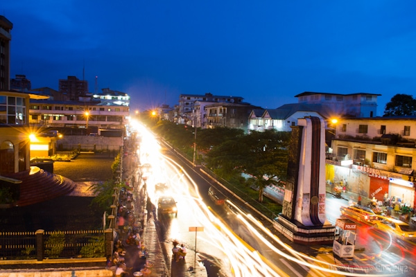 Vibrant nightlife street scene in Monrovia Liberia with colorful lights and crowds