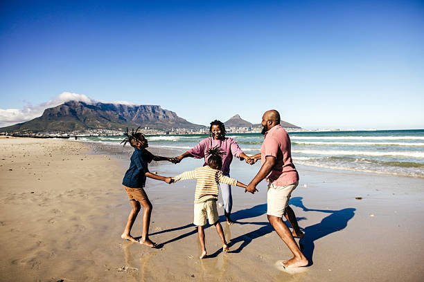 Travelers enjoying a Liberian beach in clear November weather