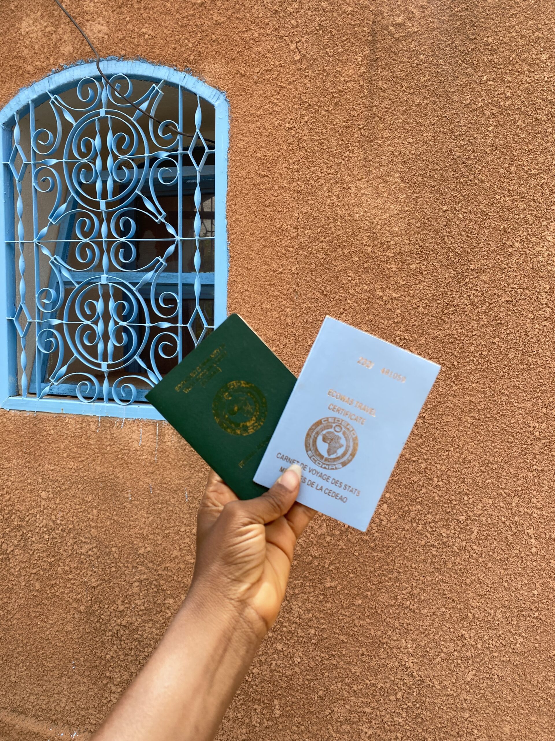 West African travelers at a border crossing with passports