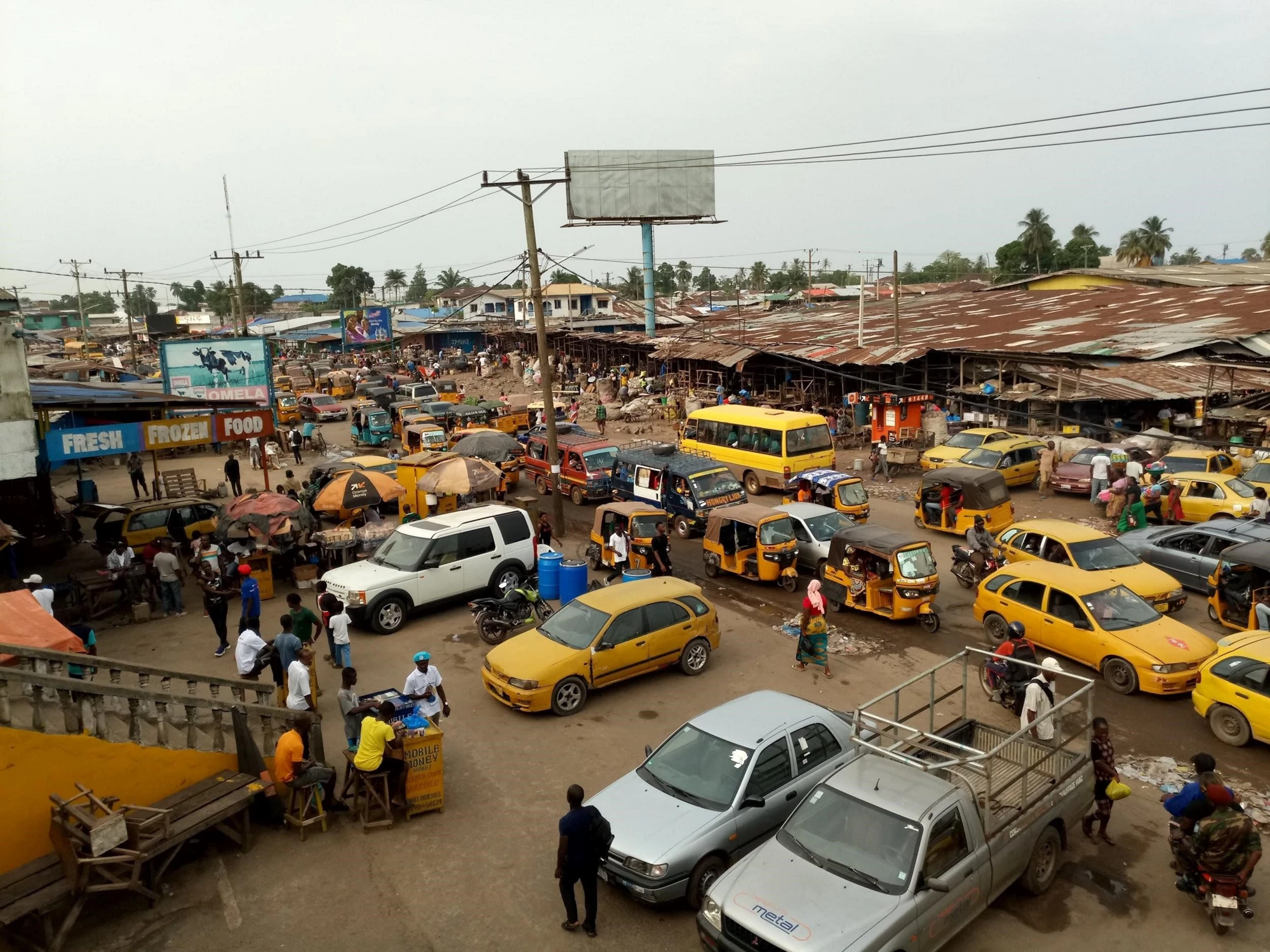 Busy street scene in Monrovia Liberia with vendors and traffic in 2026