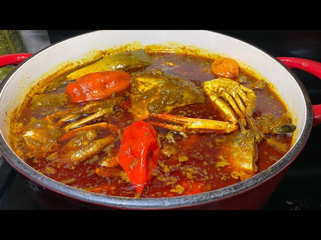 Traditional Liberian food spread including palm butter soup rice and greens