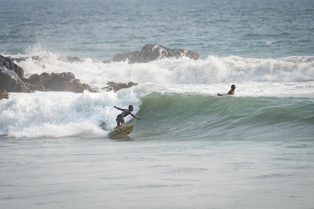 Robertsport beach Liberia surfers on Atlantic waves