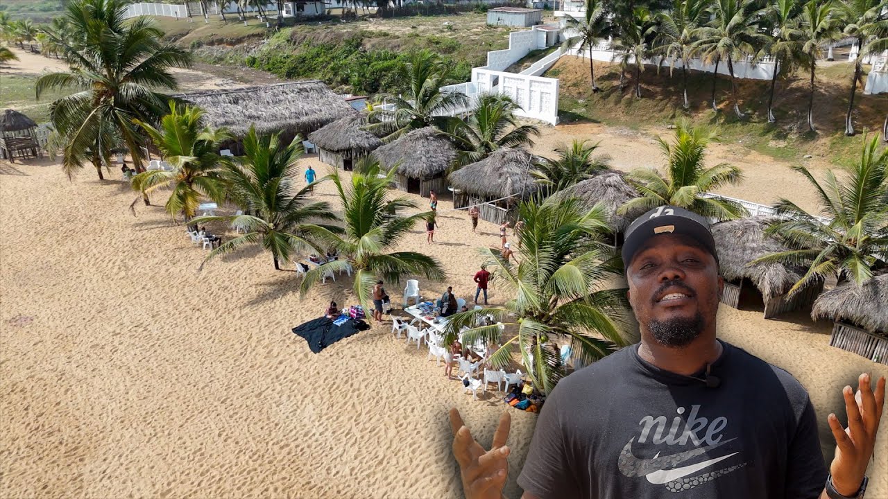 Silver Beach Liberia with calm waves, beach umbrellas, and visitors relaxing on white sand