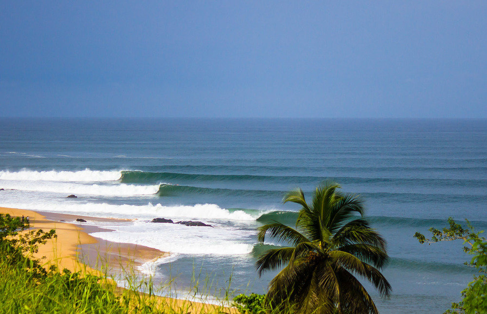 Surfer riding a wave at Robertsport Liberia West Africa