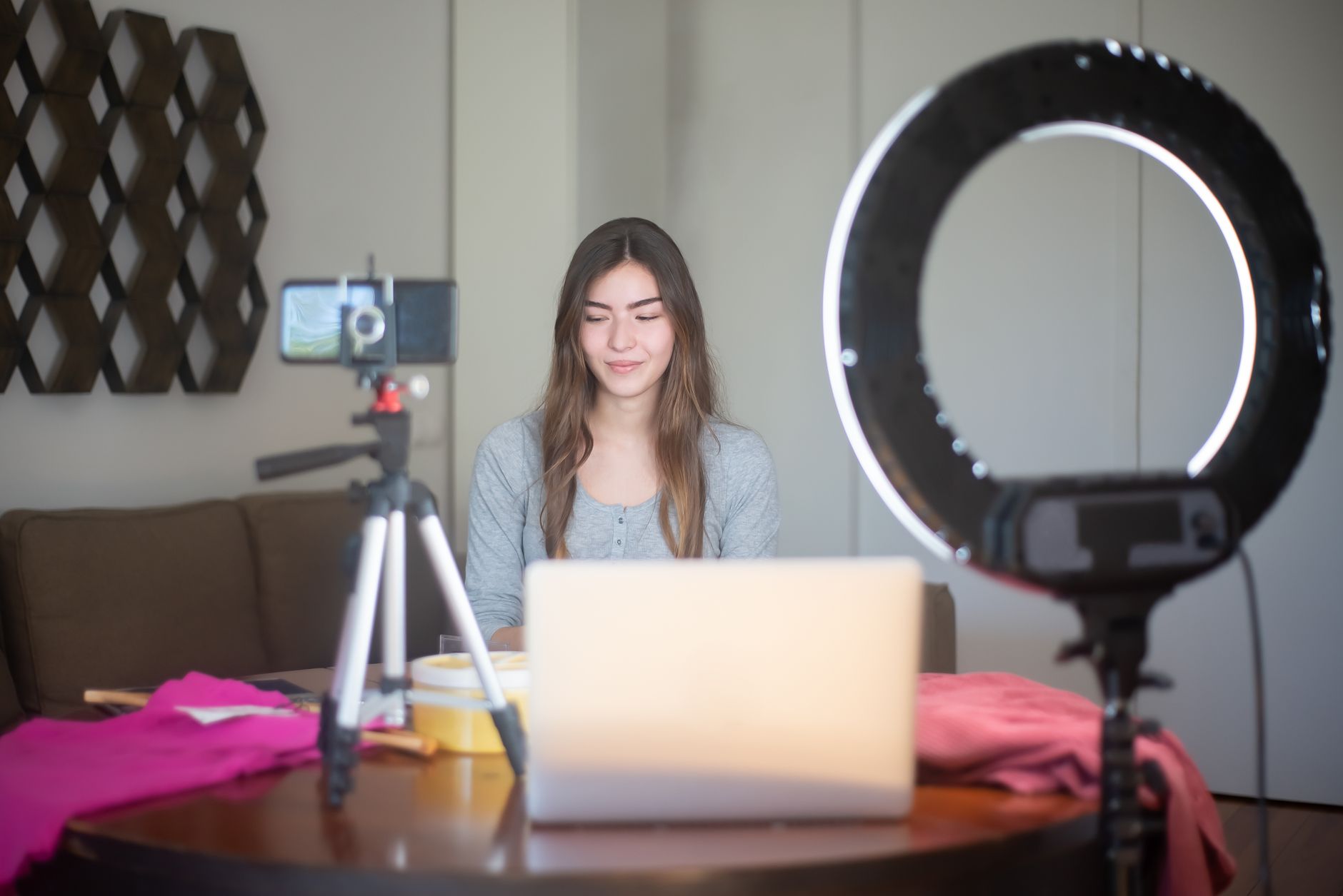 Creator comparing AI writing tools on a laptop for social media content
