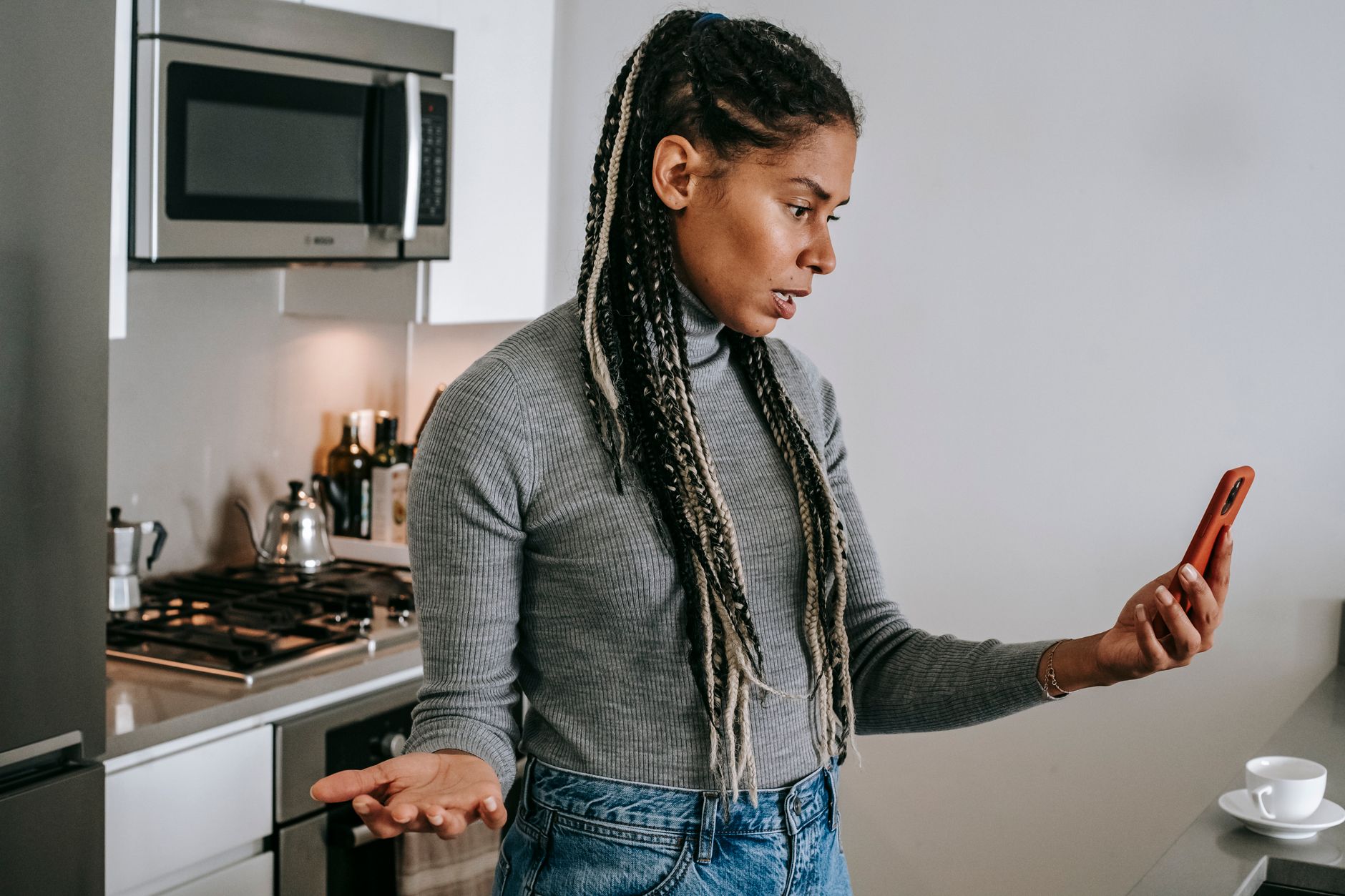 Frustrated content creator looking at poor social media engagement on phone