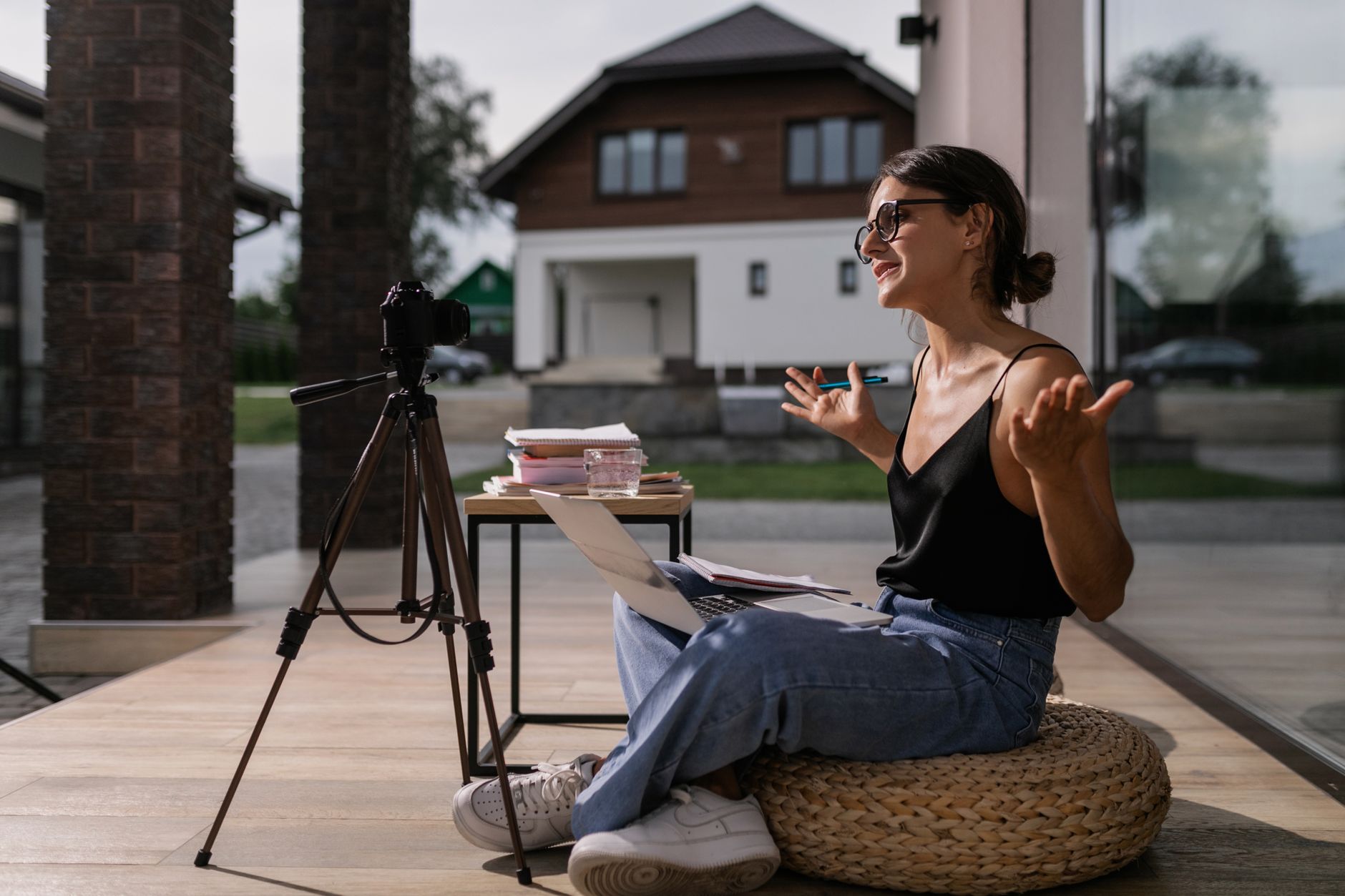Creator working on social media content with laptop and phone