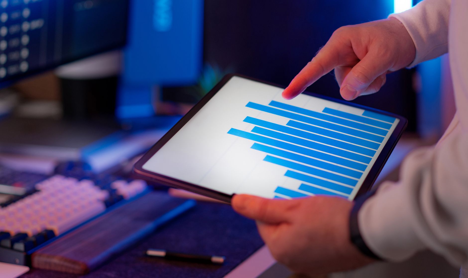 Person reviewing social media engagement metrics and AI content performance on a tablet