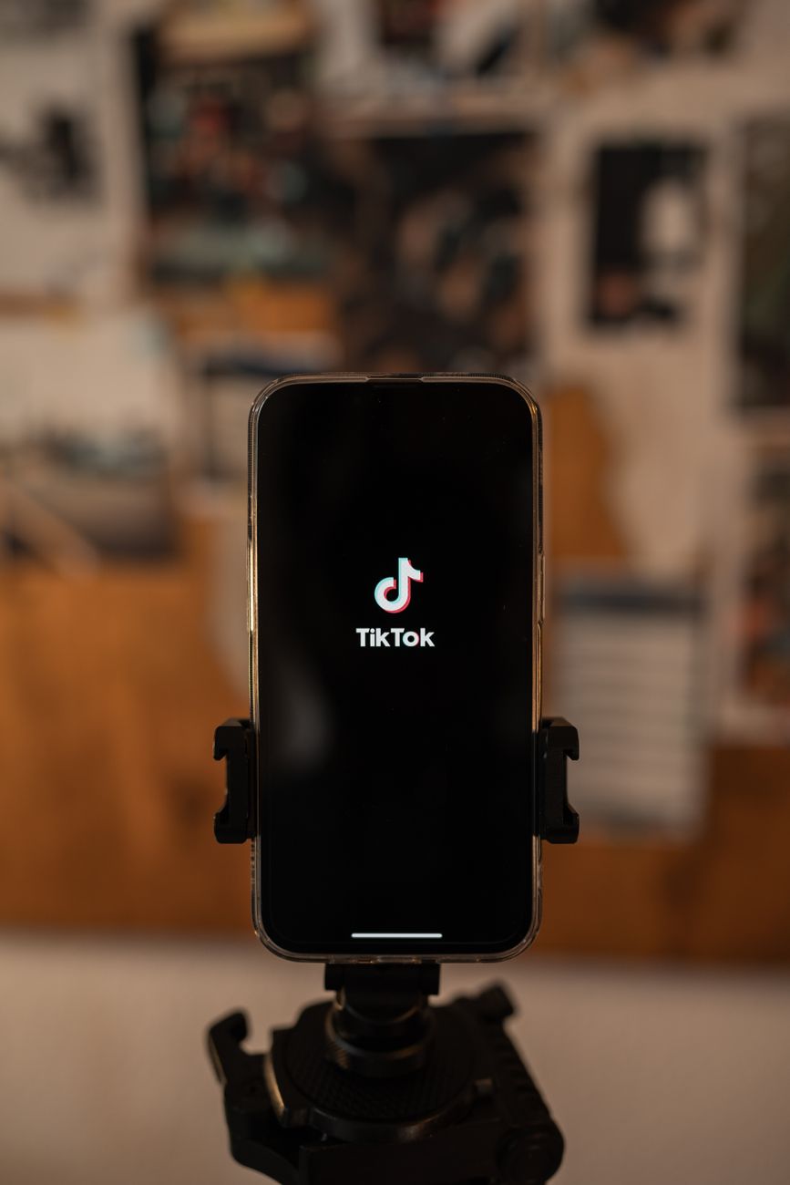 smartphone recording TikTok video with script on screen