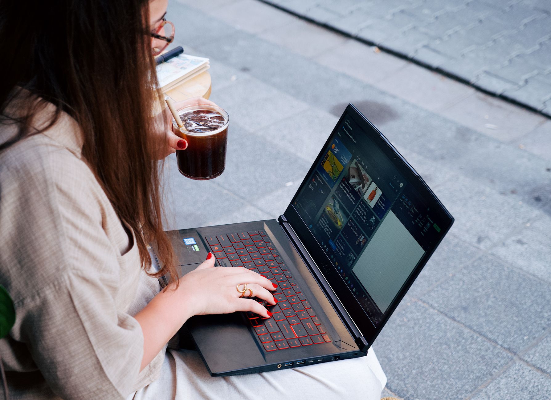 Creator using AI tools on laptop to generate viral social media content