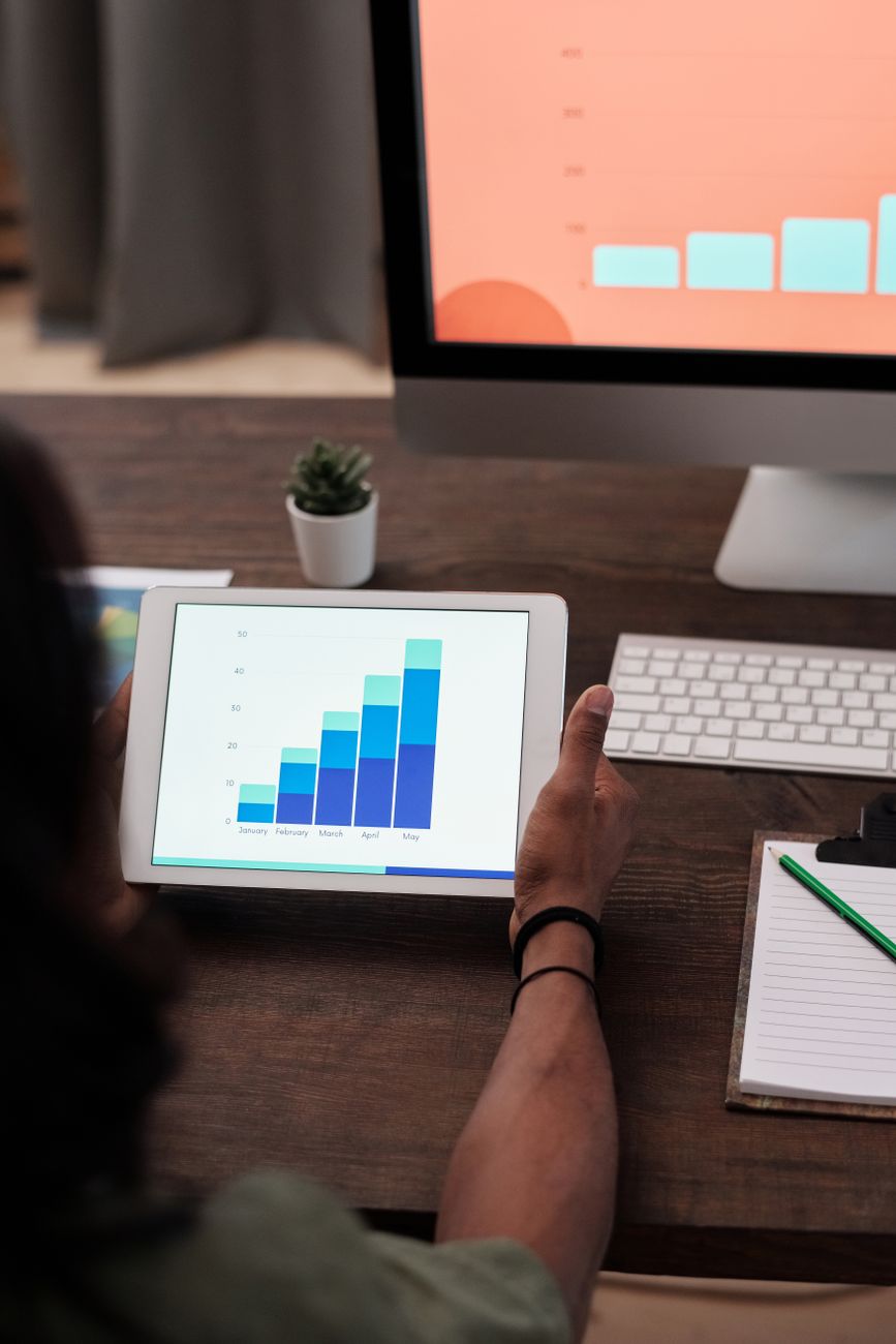 Social media creator reviewing AI-generated content on dual screens