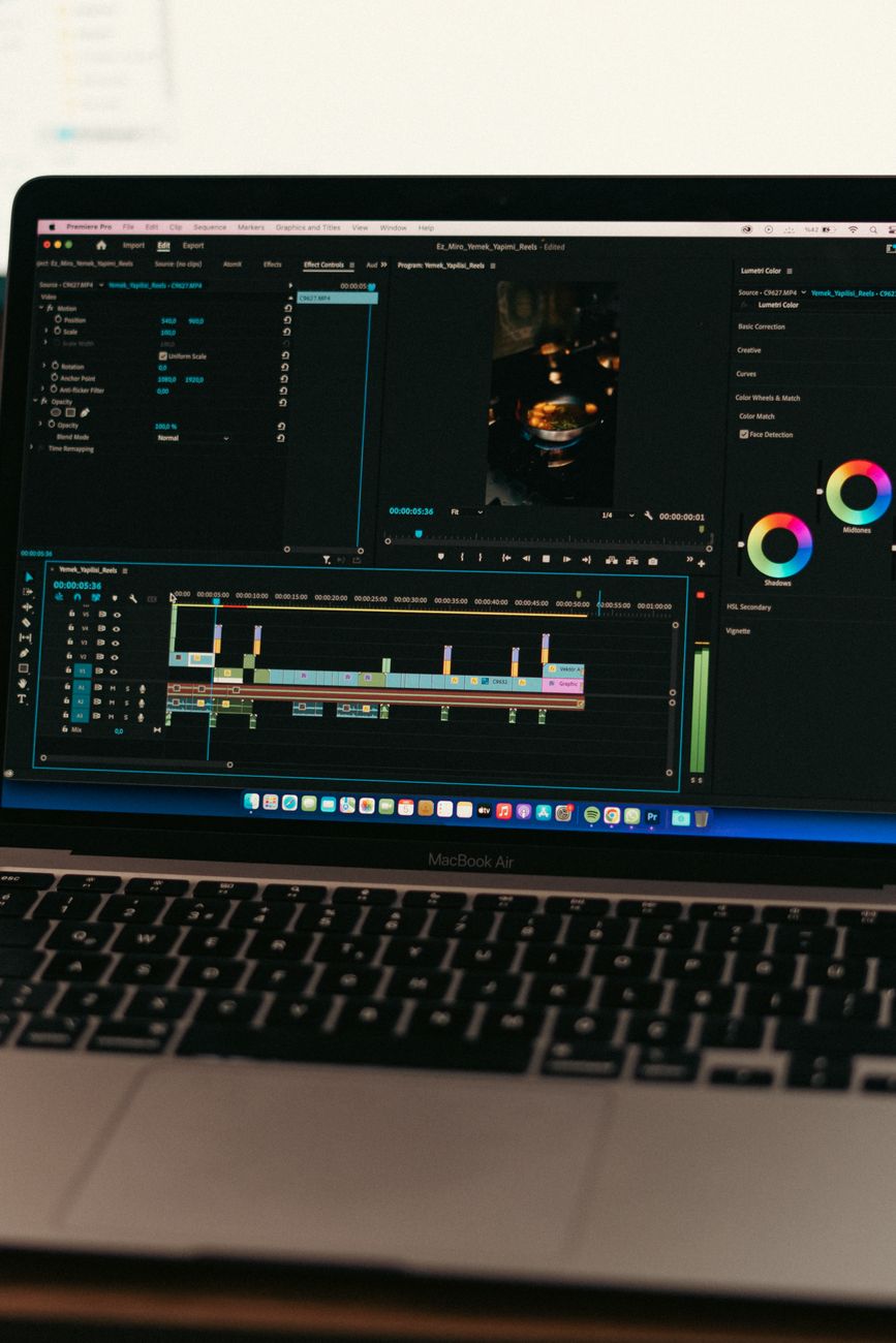 Creator building a social media content workflow on a laptop with multiple AI tool tabs open
