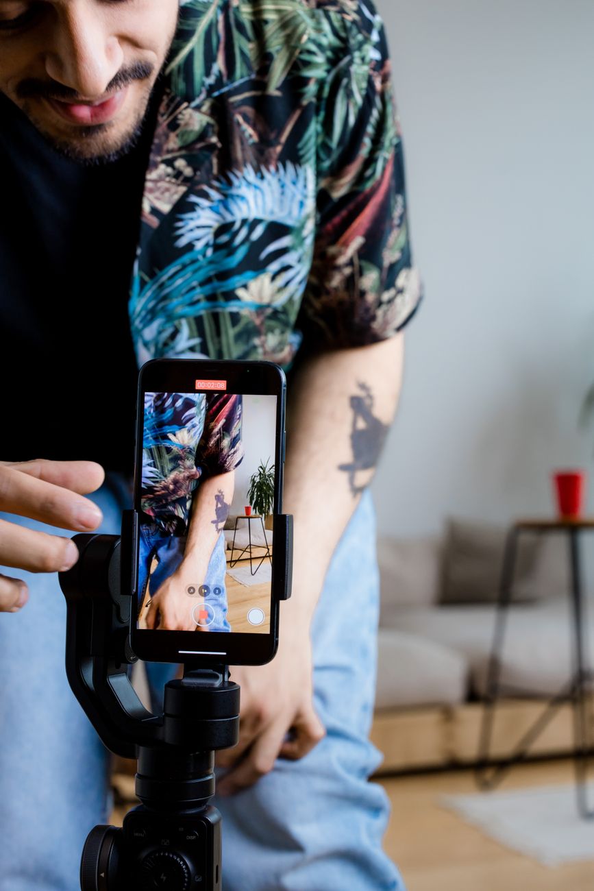 Creator filming a YouTube Shorts video on a smartphone
