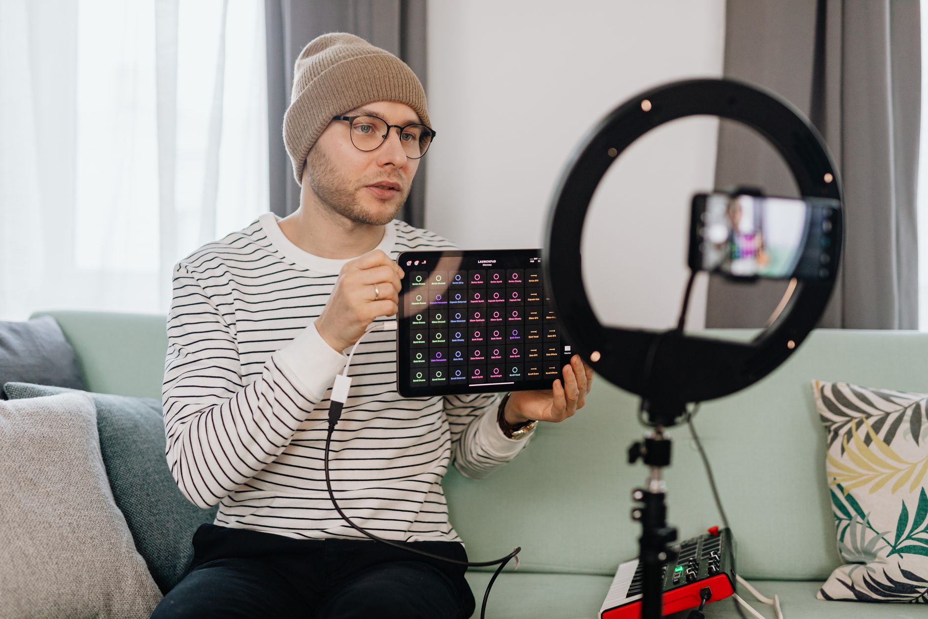 Social media creator reviewing video performance analytics on tablet