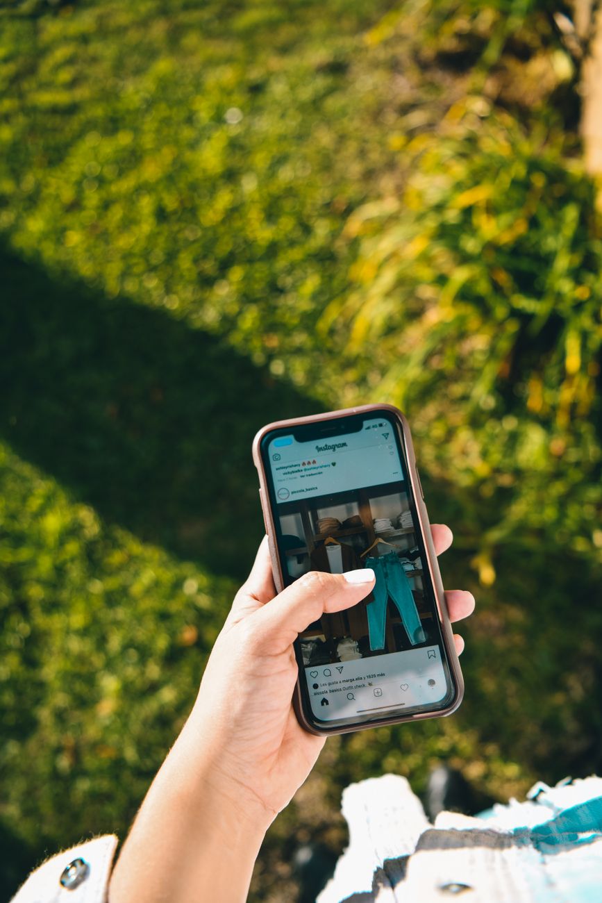 Person scrolling through Instagram Reels on smartphone