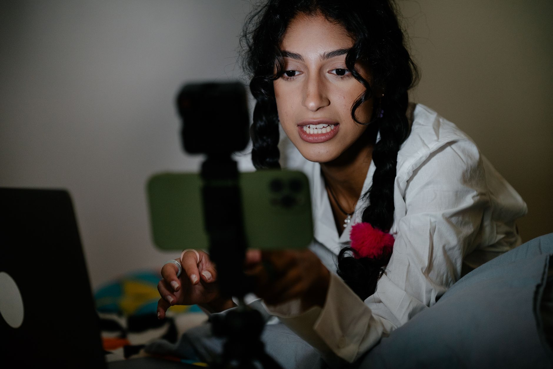 Creator reviewing YouTube analytics on a laptop screen