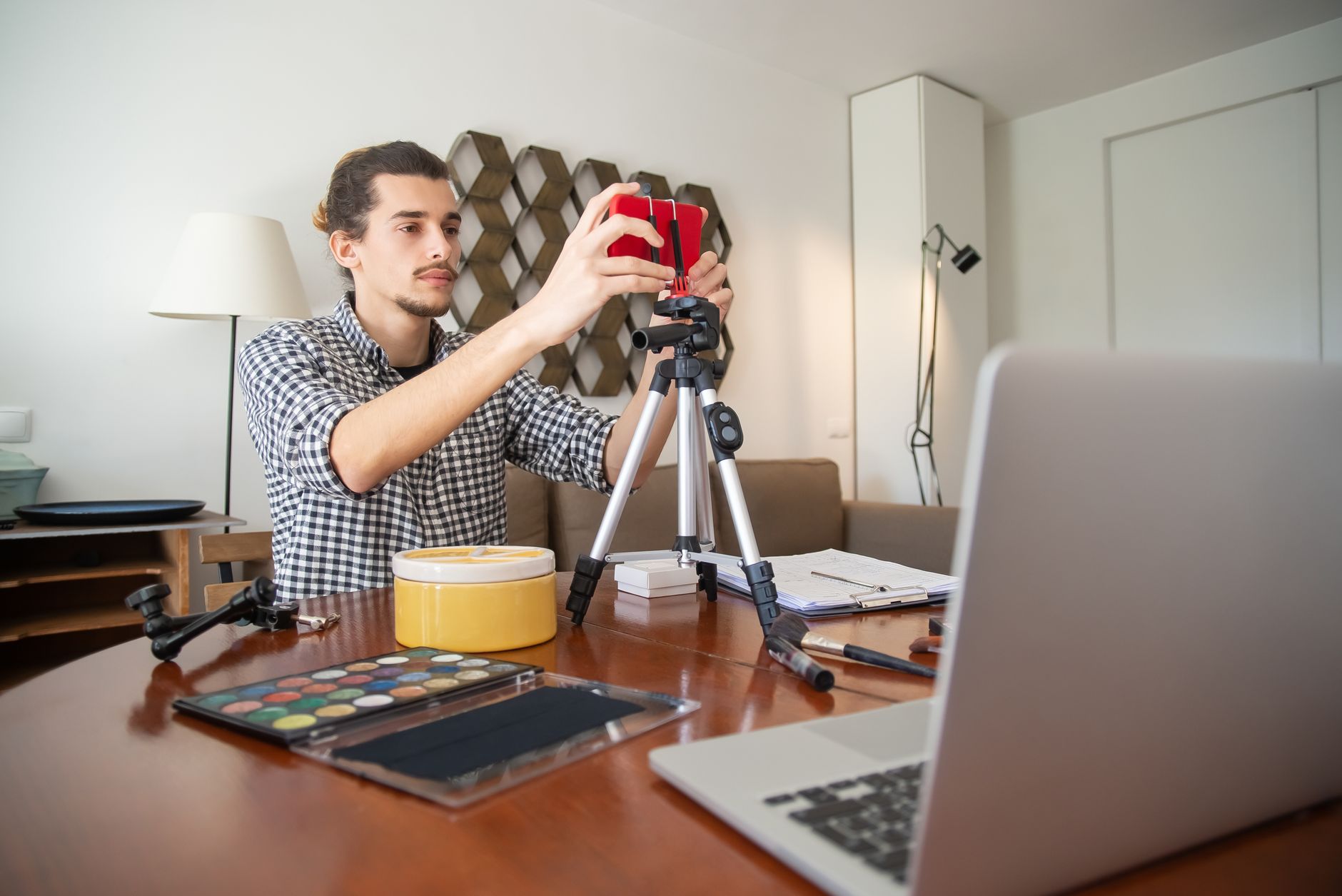 Creator analyzing TikTok video structure on a laptop