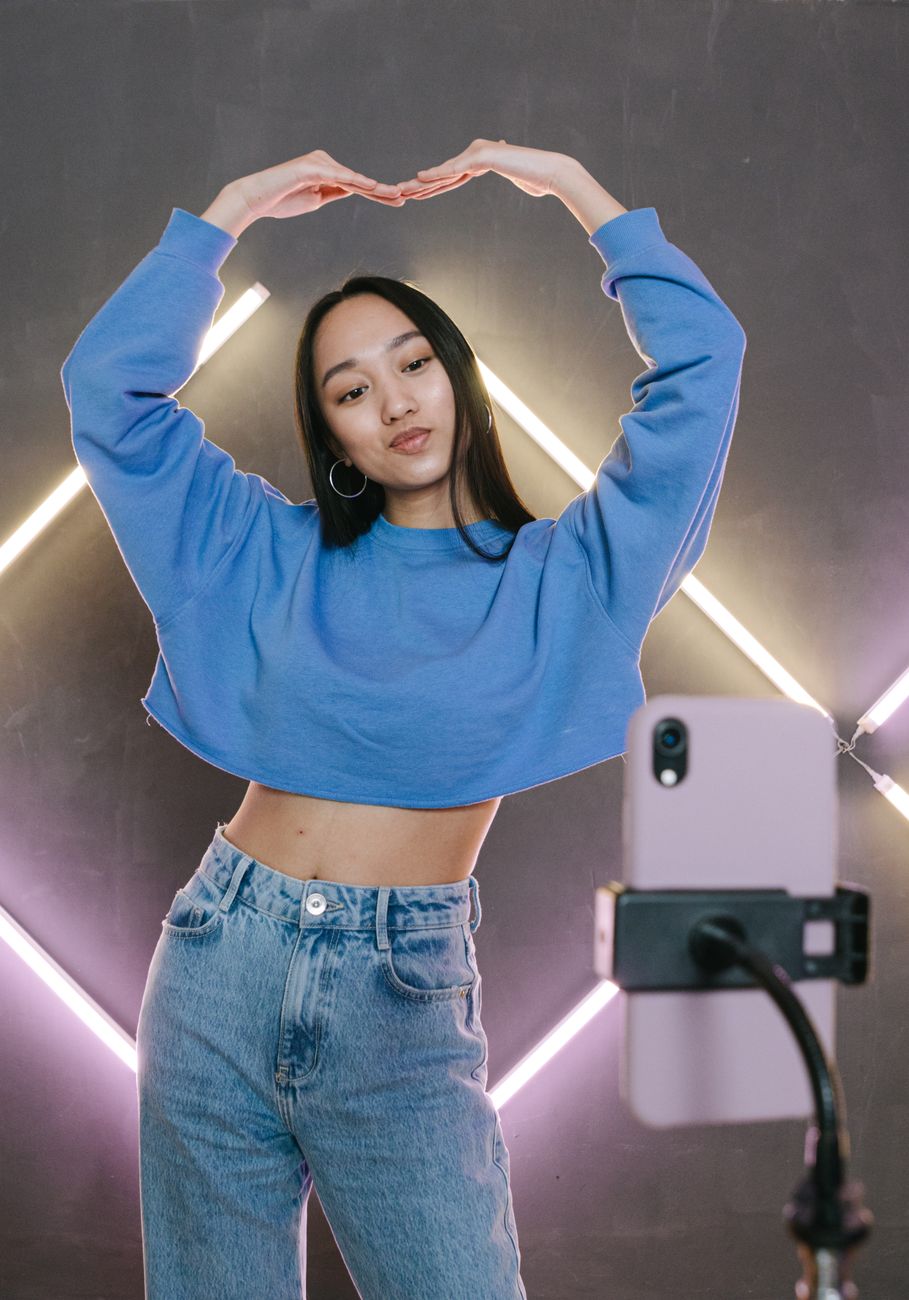 Social media creator recording TikTok video with script notes