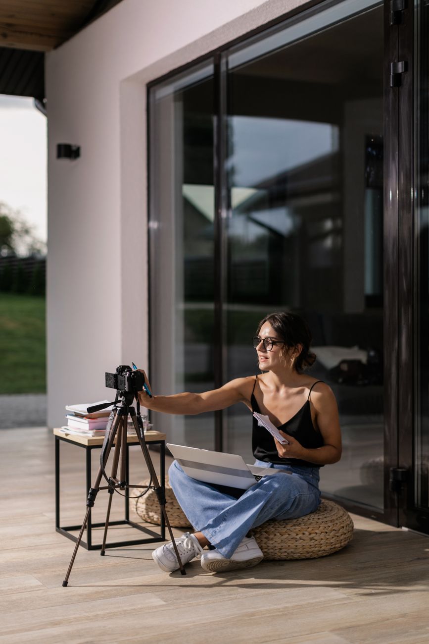 Creator using AI tools on laptop to generate social media content