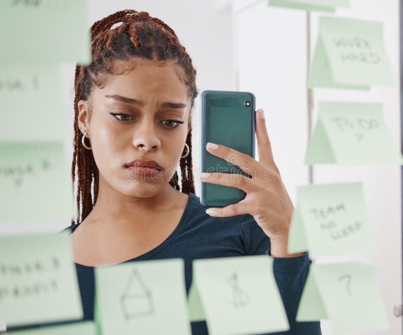 Creator frustrated looking at TikTok app on smartphone with missing features