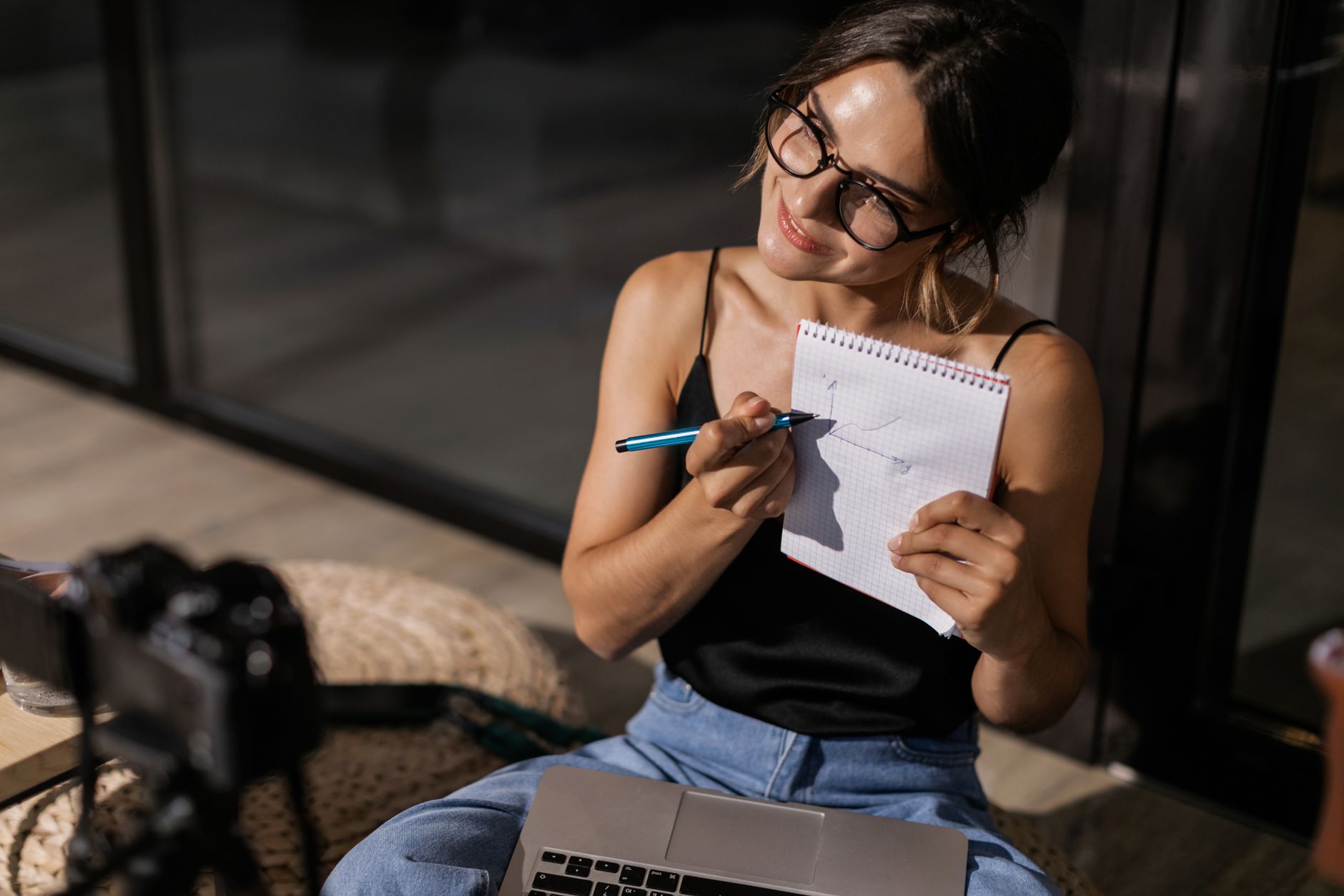 Creator planning a social media content workflow on a laptop with AI tools open