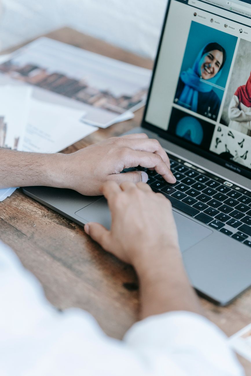 Creator comparing social media scheduling dashboards on a laptop
