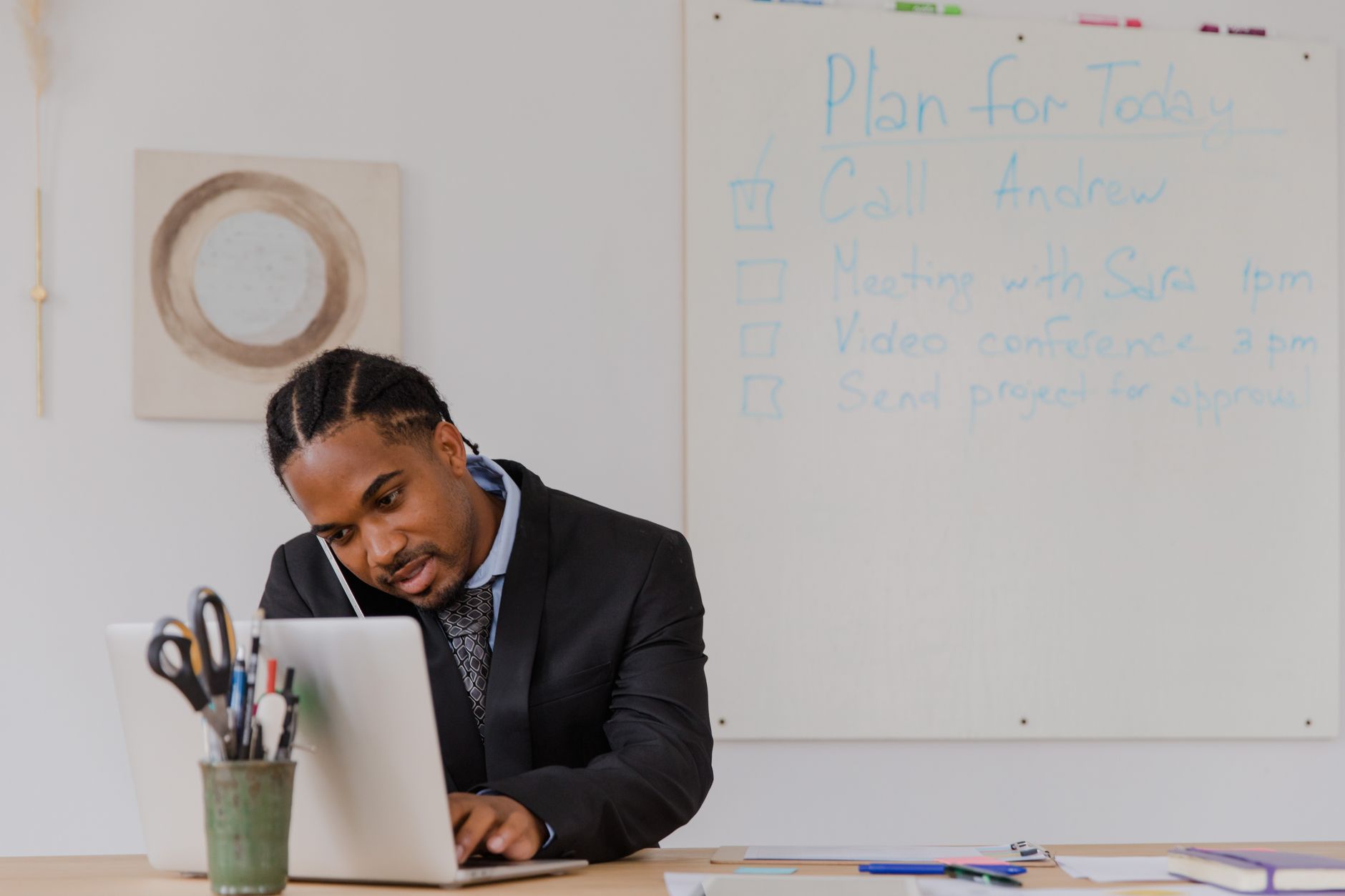 Small business owner reviewing digital marketing strategy on laptop