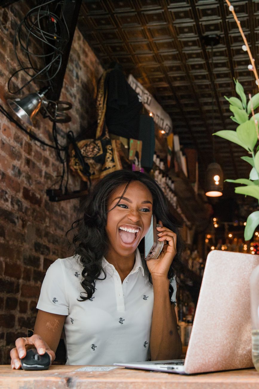Small business owner reviewing digital marketing strategy on laptop