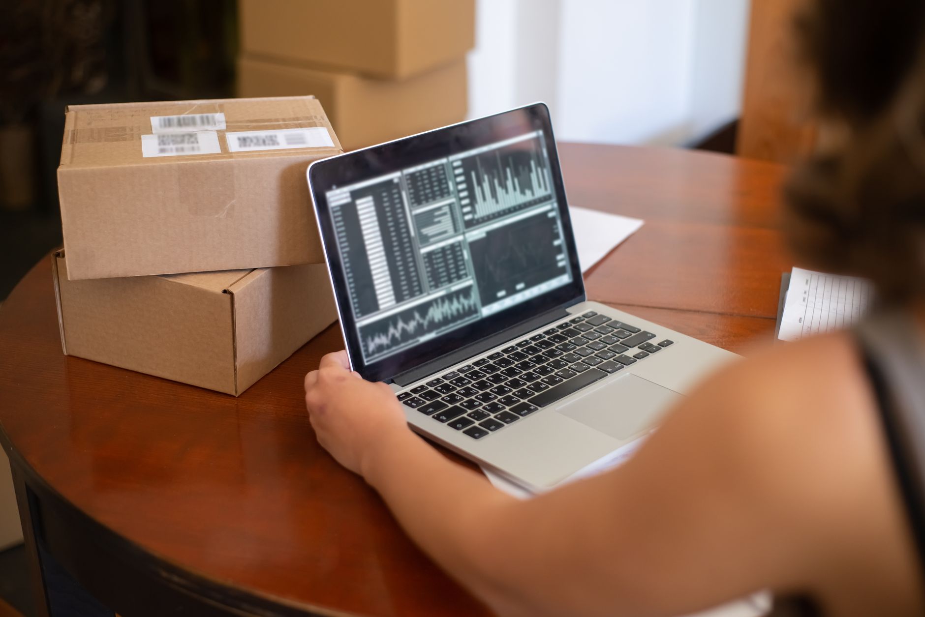 Small business owner reviewing digital marketing analytics on a laptop