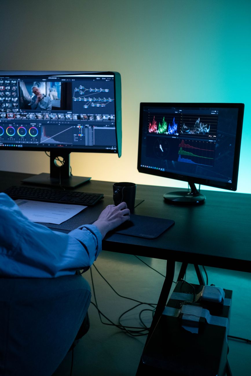 Marketer reviewing and editing a webpage on a computer monitor