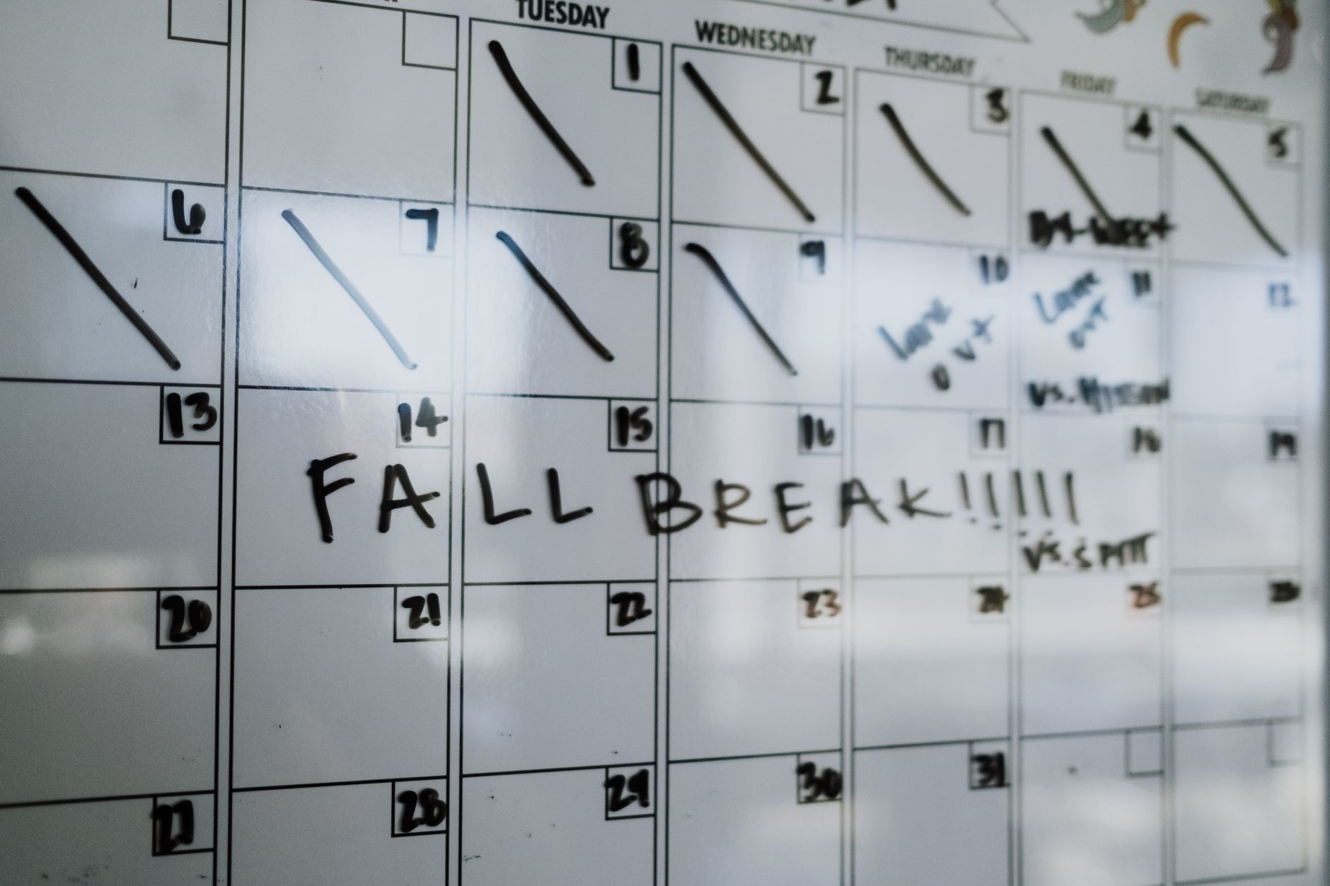 Marketing team planning content calendar on a whiteboard