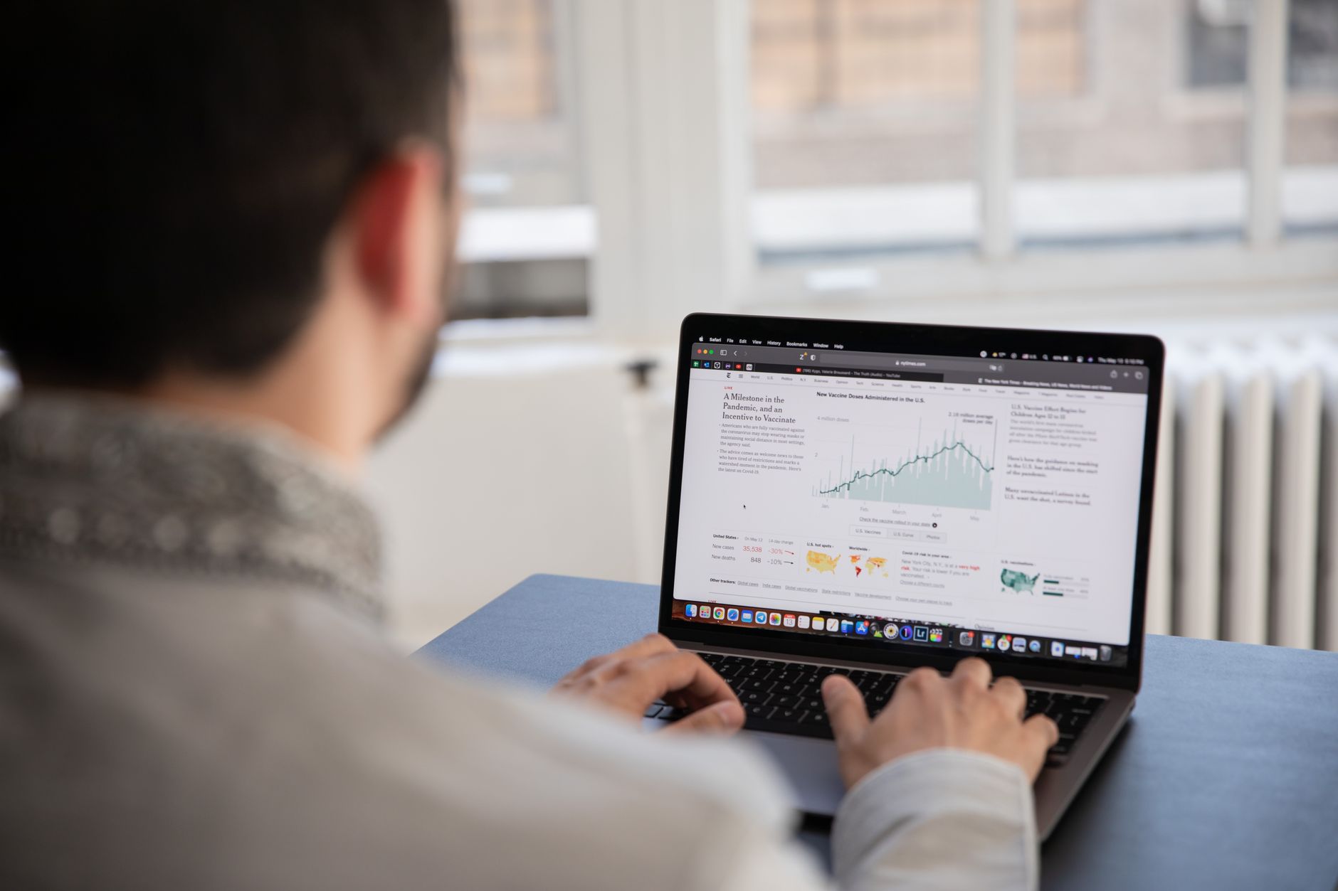 Digital marketing professional reviewing analytics dashboard on laptop