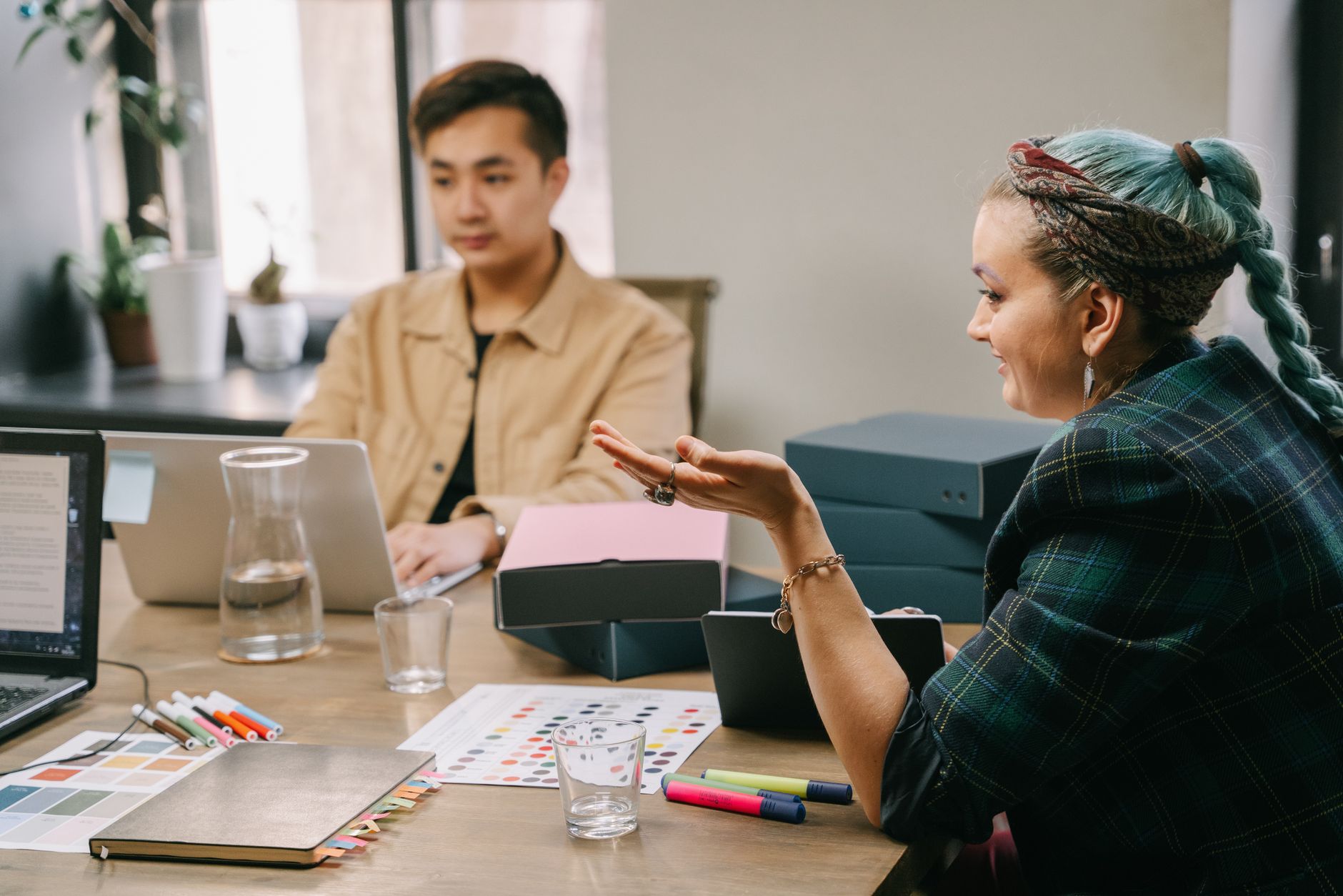 Marketing team collaborating on strategy in modern agency office