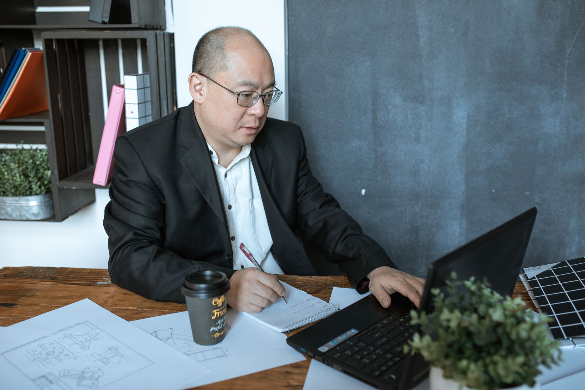 Small business owner reviewing digital marketing strategy on a laptop