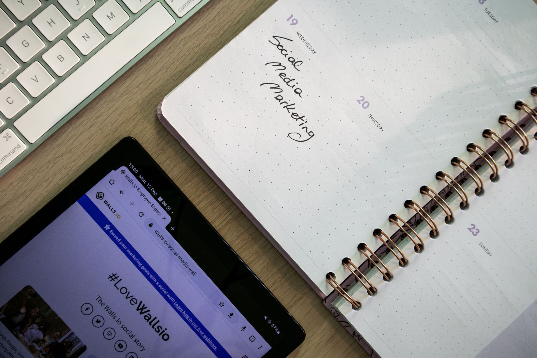 Small business owner scheduling social media posts on tablet