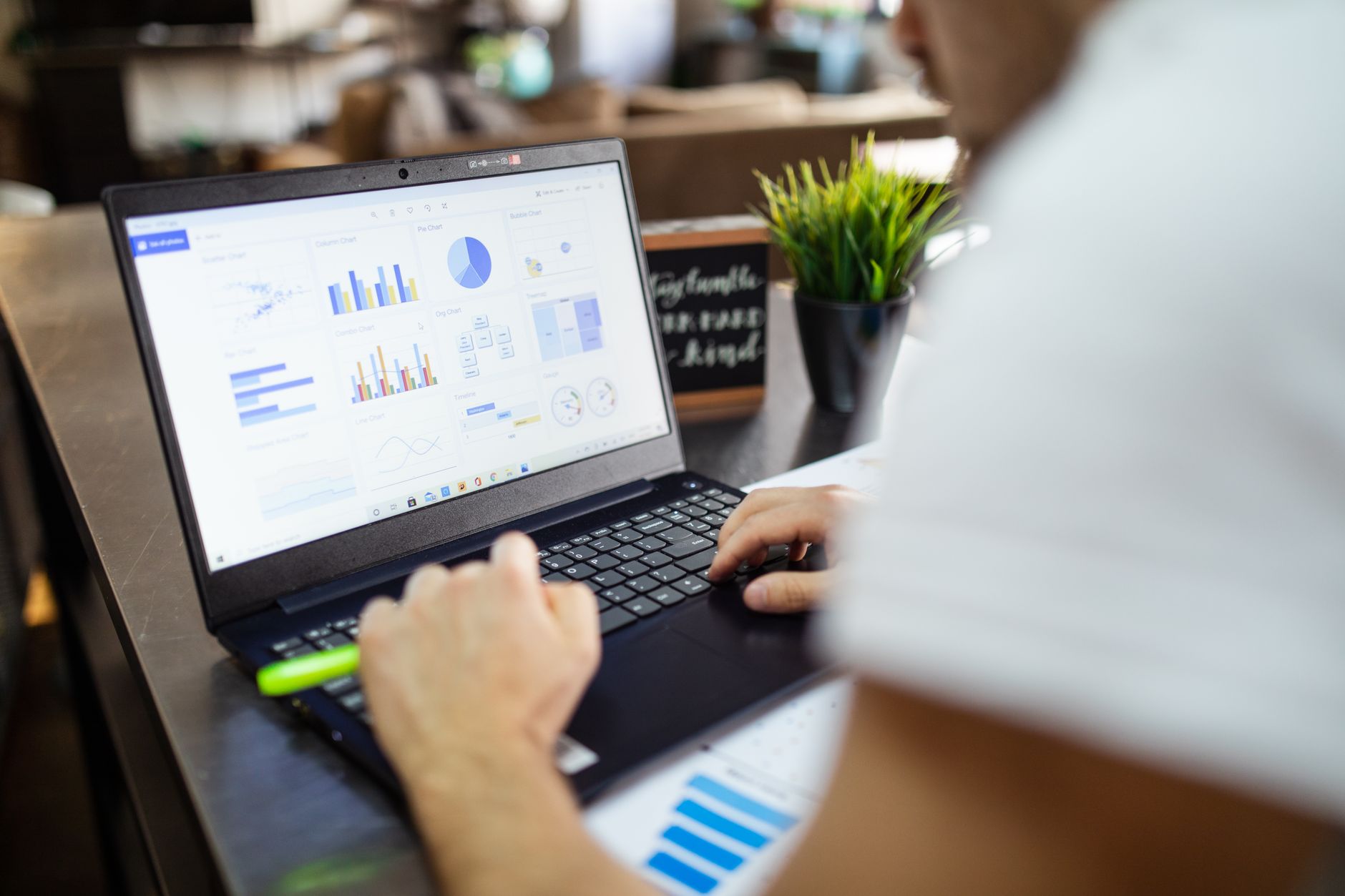 Digital marketer reviewing 2026 blog topic ideas on a laptop