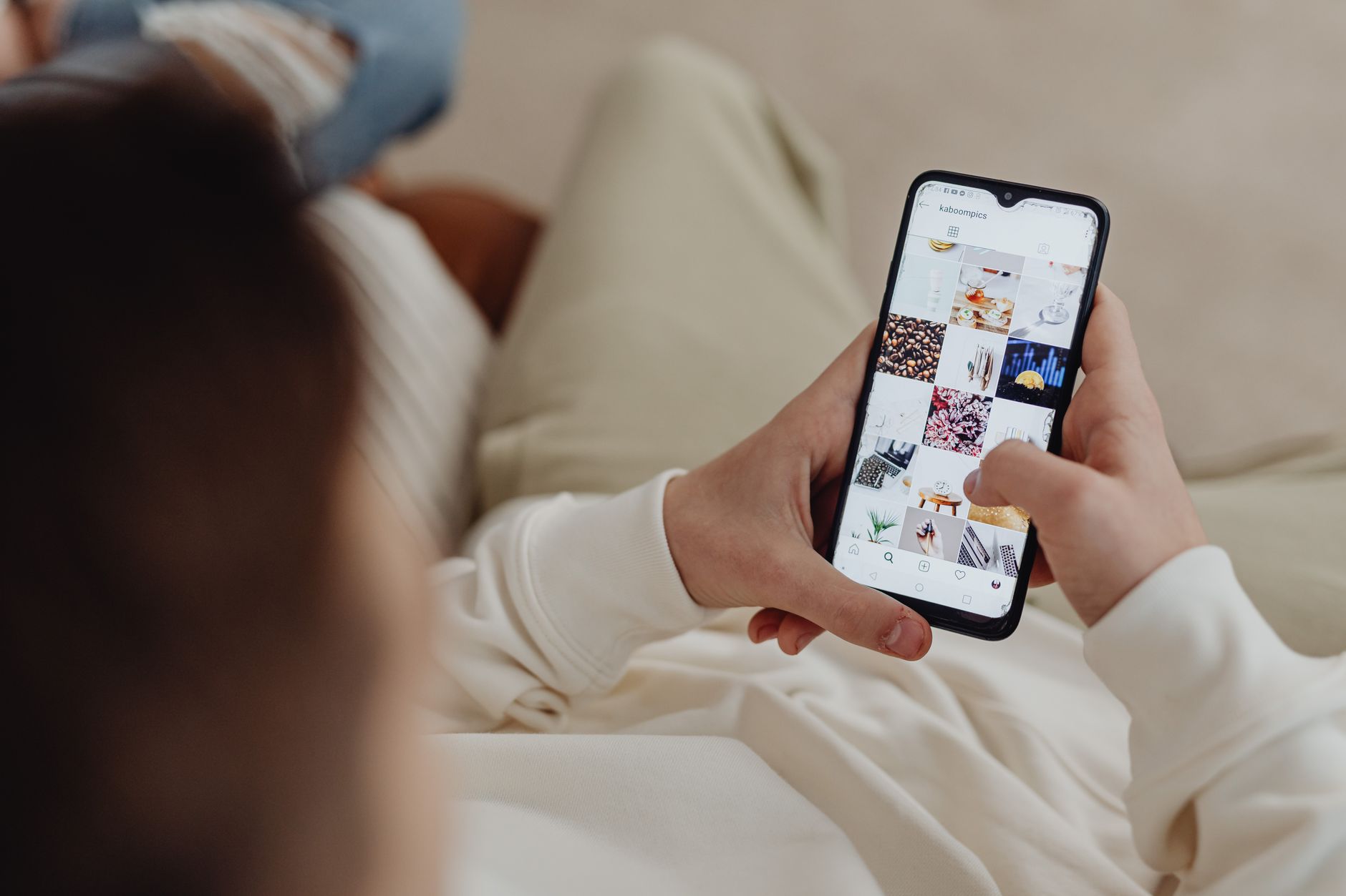 Person scrolling TikTok and Instagram on a smartphone for social search