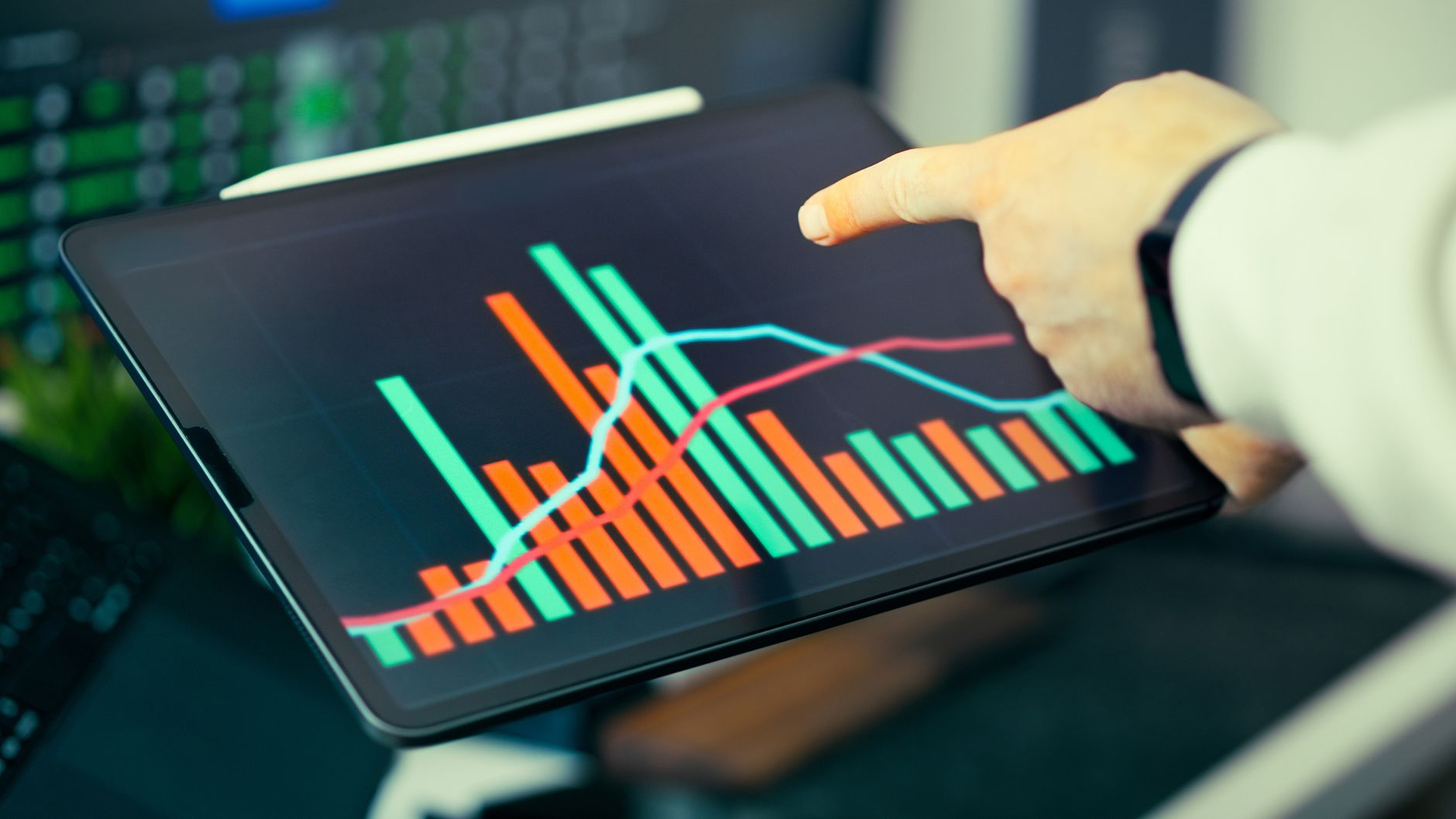 Digital marketer reviewing analytics dashboard on a desktop monitor