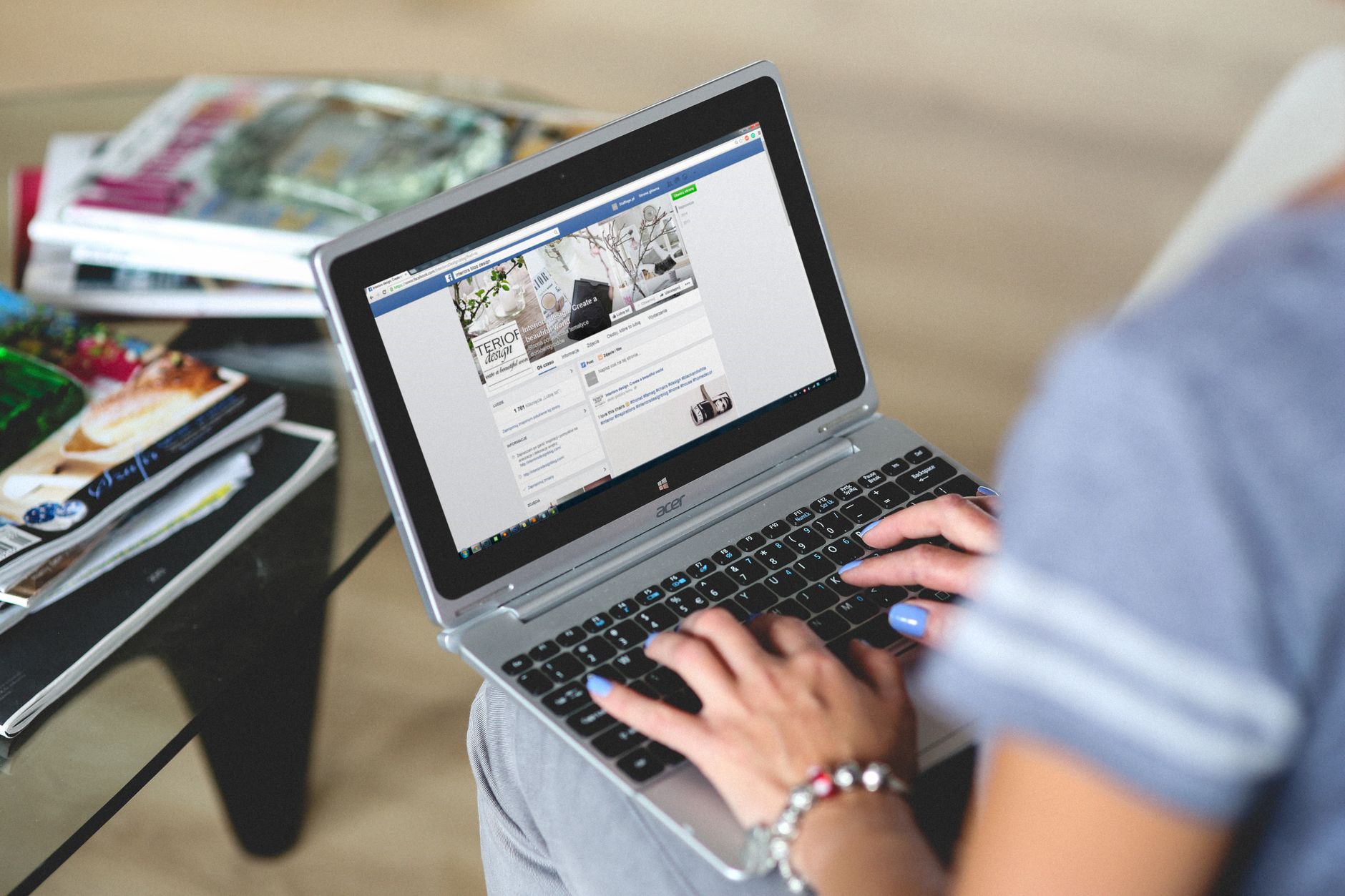Marketer typing keyword-rich caption on a laptop for social media post