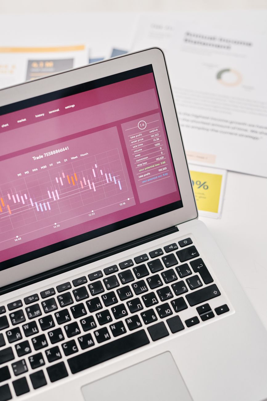 Person conducting a content audit on a laptop with analytics dashboard
