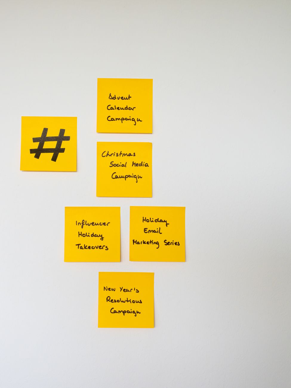Digital marketing professional scheduling social media video content on a planning calendar