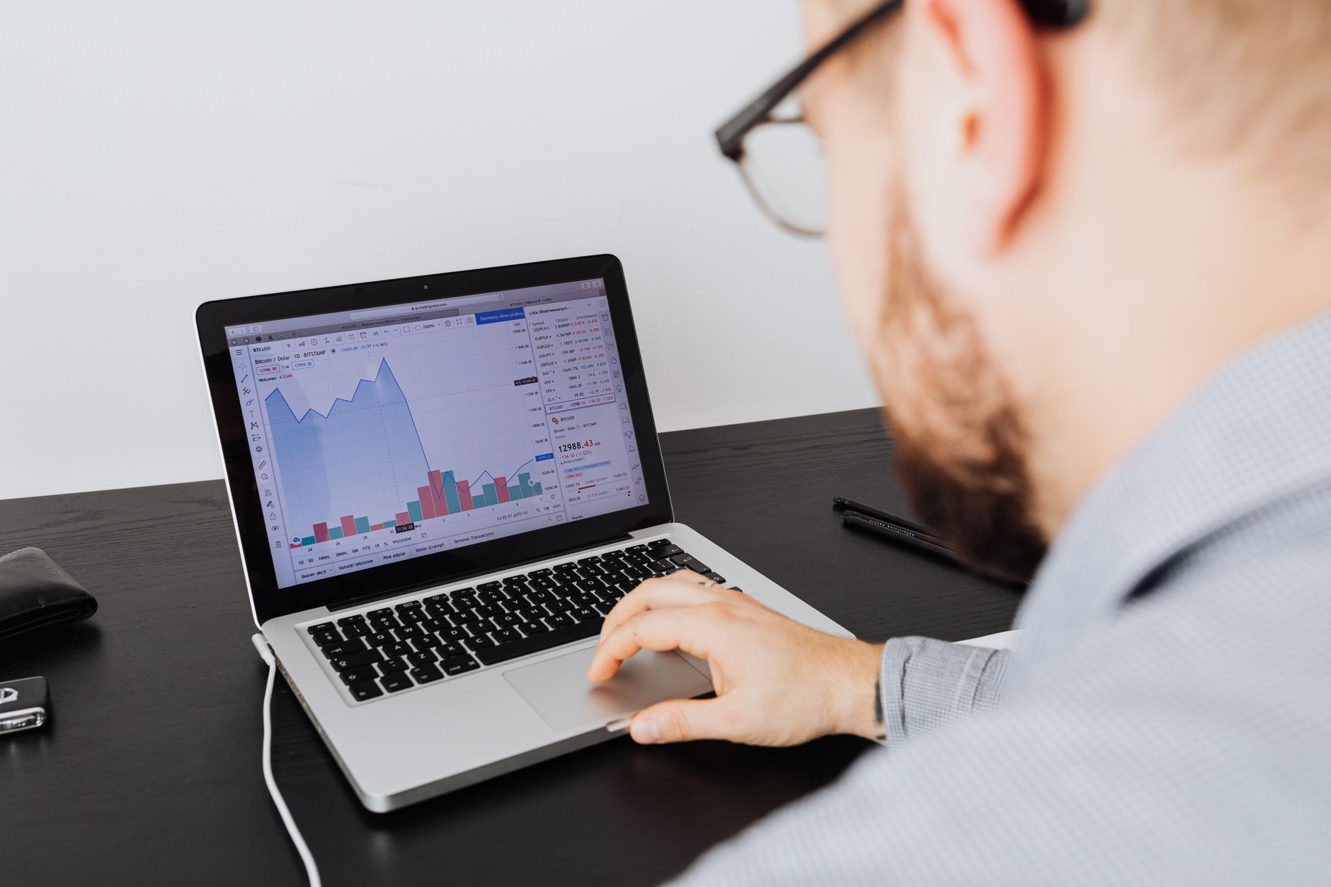 Small business owner reviewing digital marketing analytics on a laptop