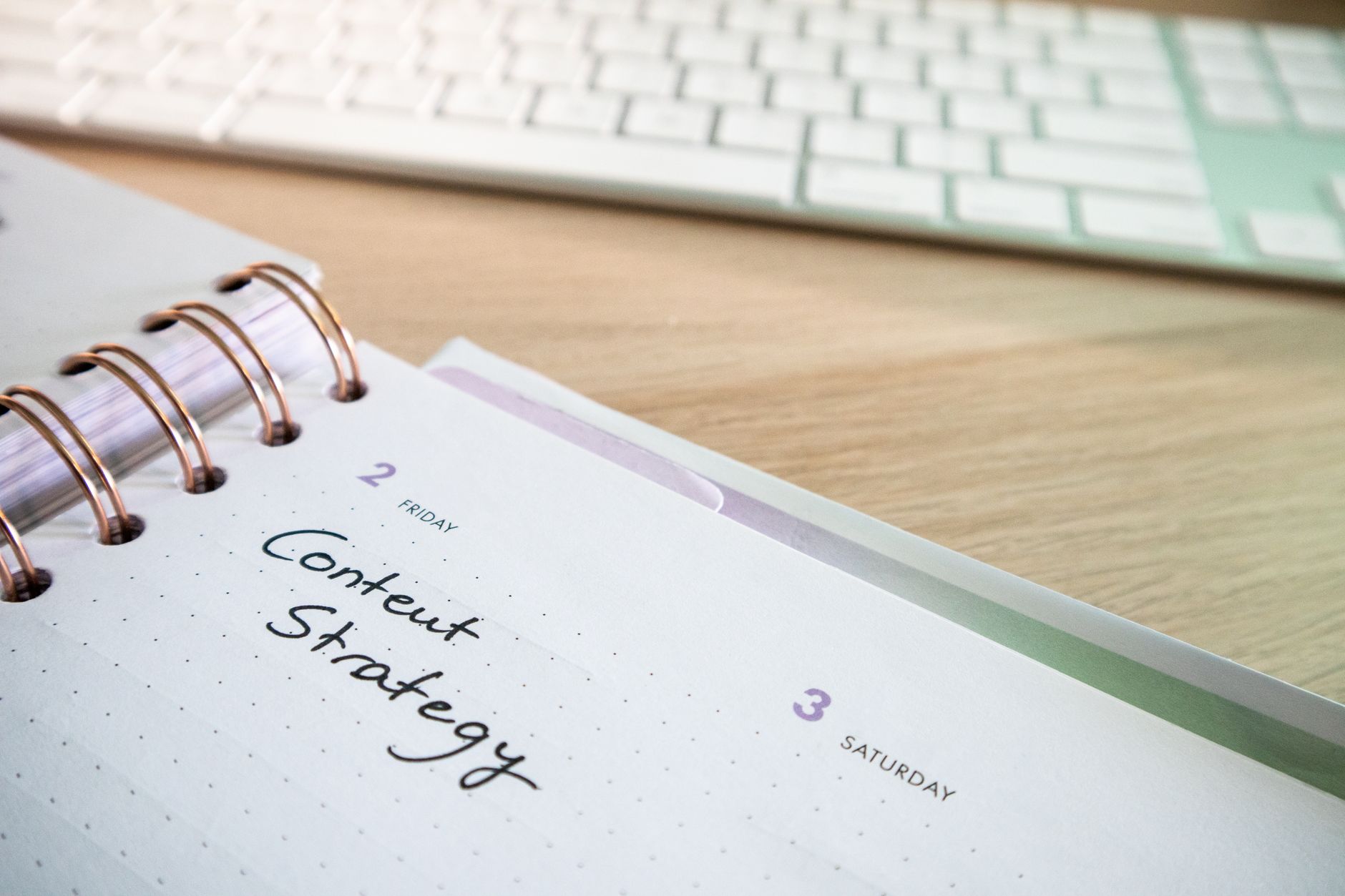 Content marketer repurposing blog post into social media graphics and videos