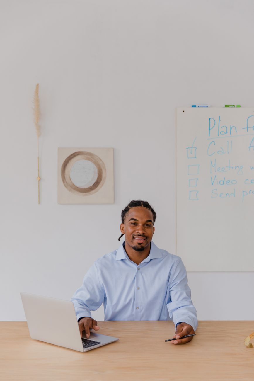 Small business owner reviewing digital marketing strategy on laptop