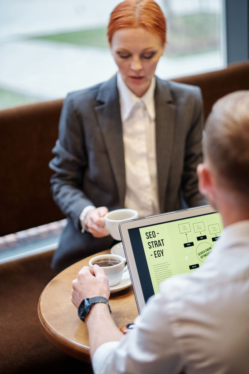 Website optimization dashboard showing SEO audit results on a laptop screen