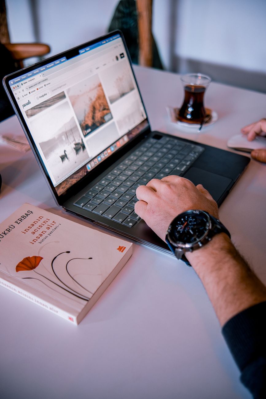 Beginner sitting at laptop planning a digital marketing learning roadmap