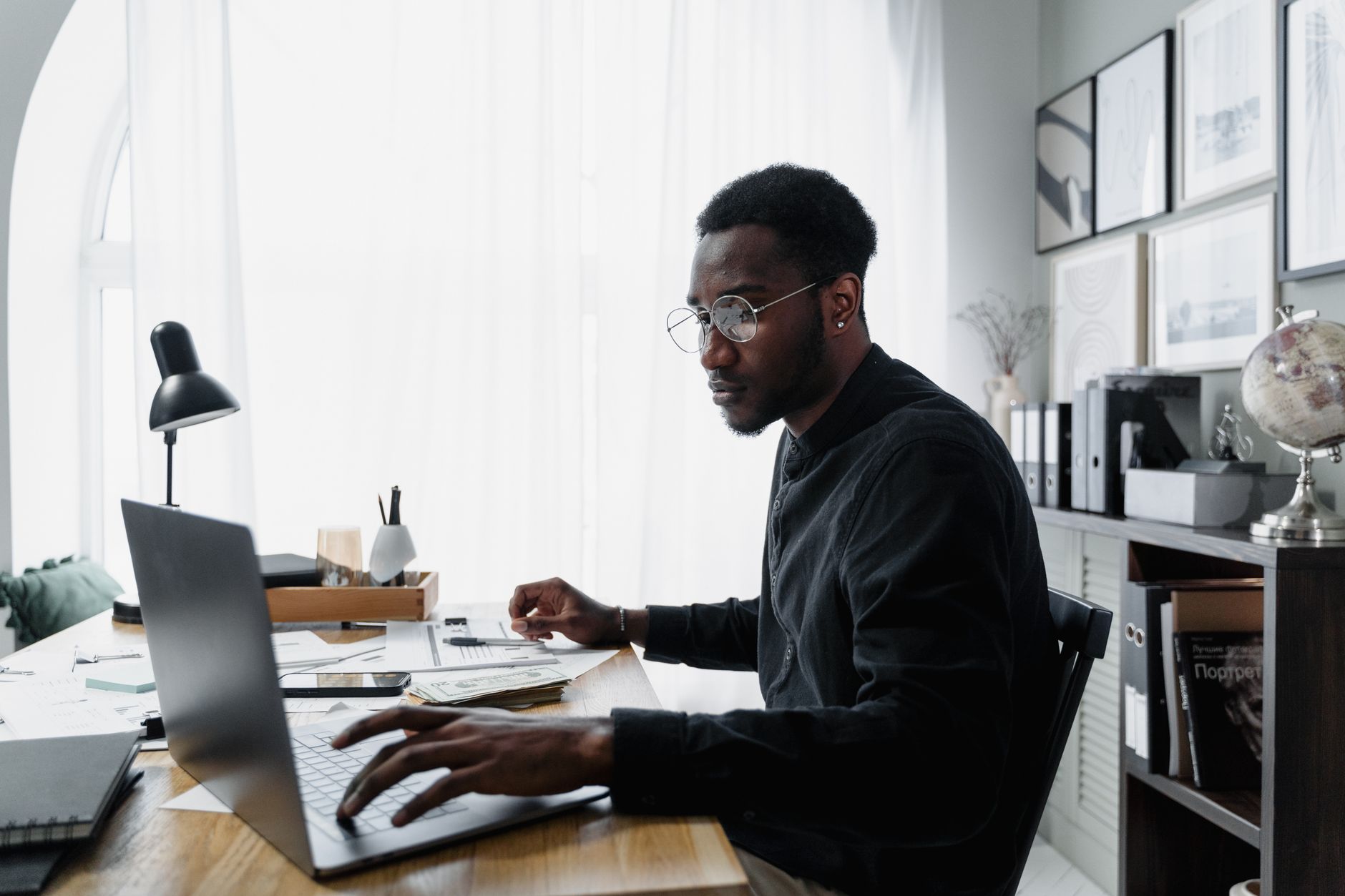 Remote digital marketer working from home on a laptop with analytics dashboard