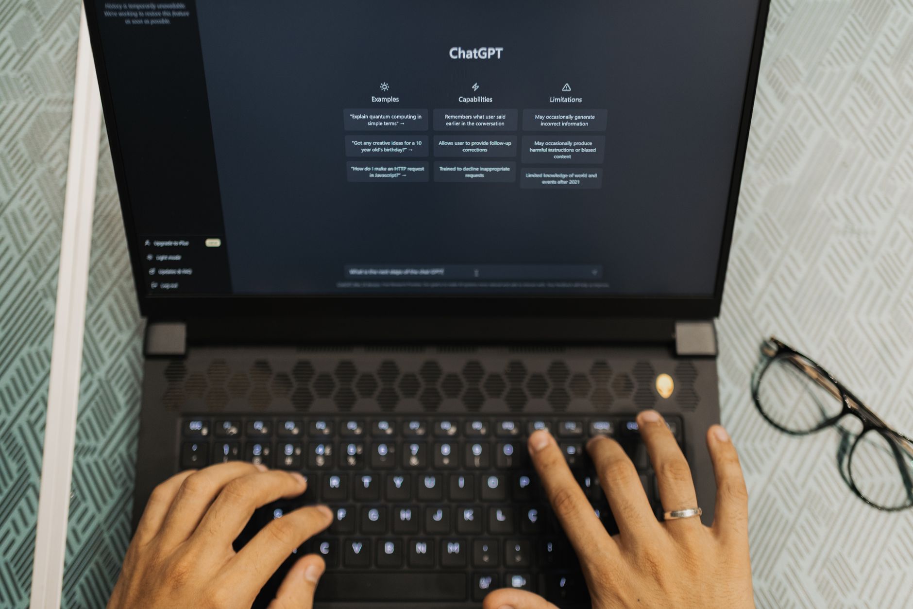 Person using AI search tools on laptop for digital marketing research