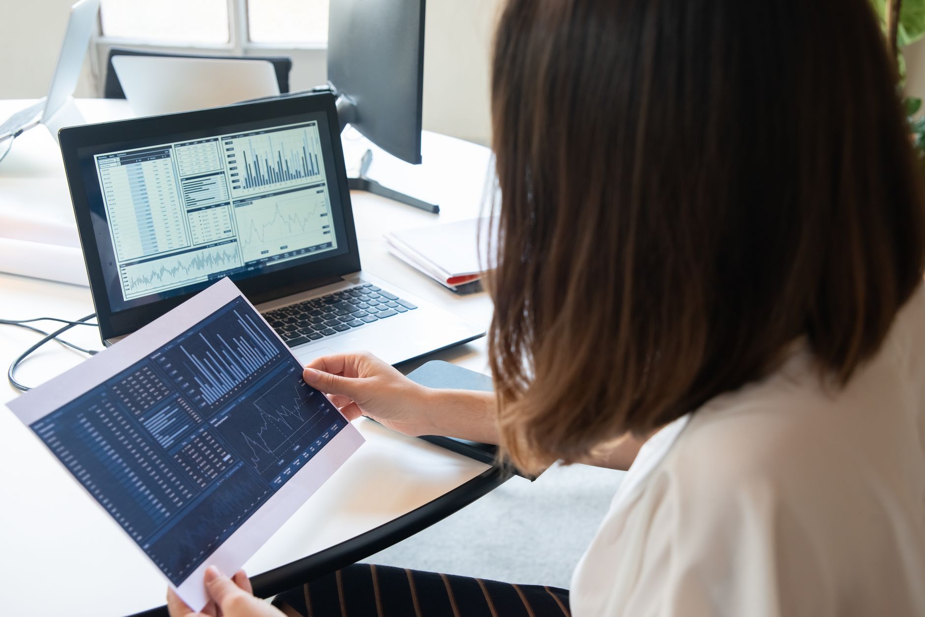 Digital marketer reviewing website analytics and SEO performance on desktop screen