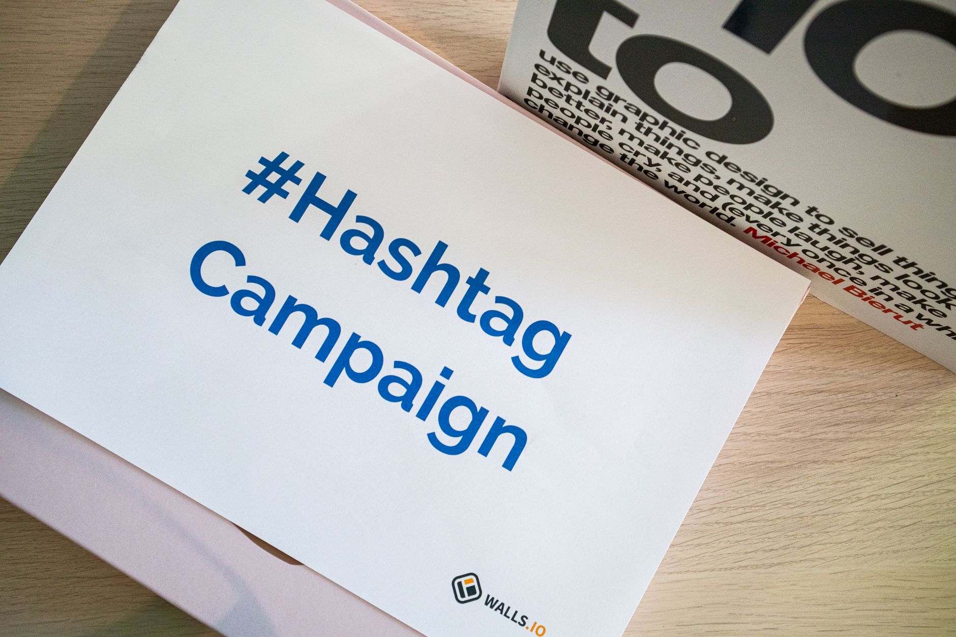 Customer holding a product and taking a selfie for a brand hashtag campaign